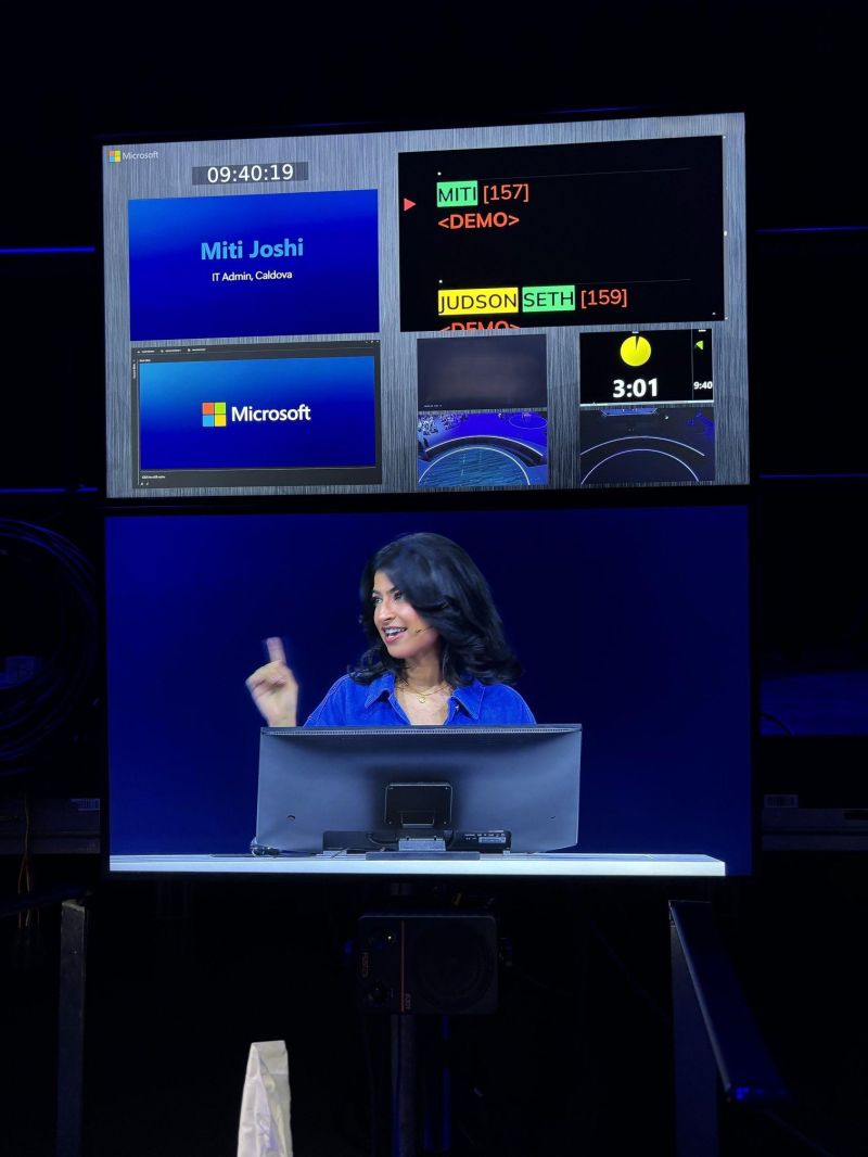 Backstage monitors showing Miti Joshi presenting a live demo, with speaker cues and a countdown timer.